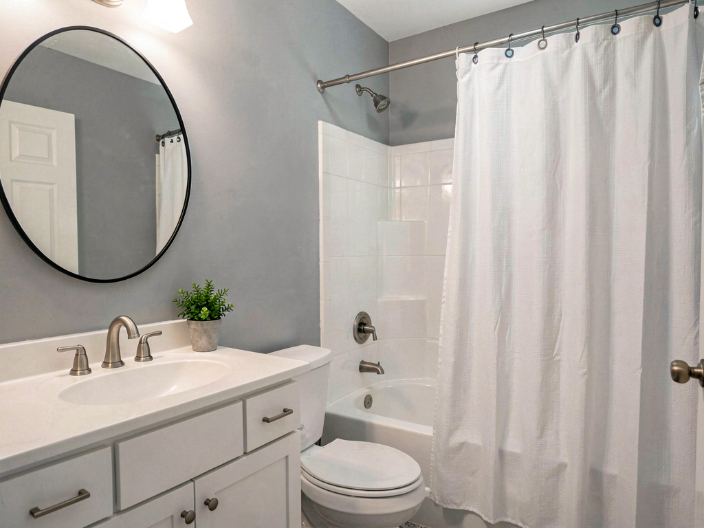 Budget-friendly bathroom remodel cost cosmetic refresh with new paint and hardware