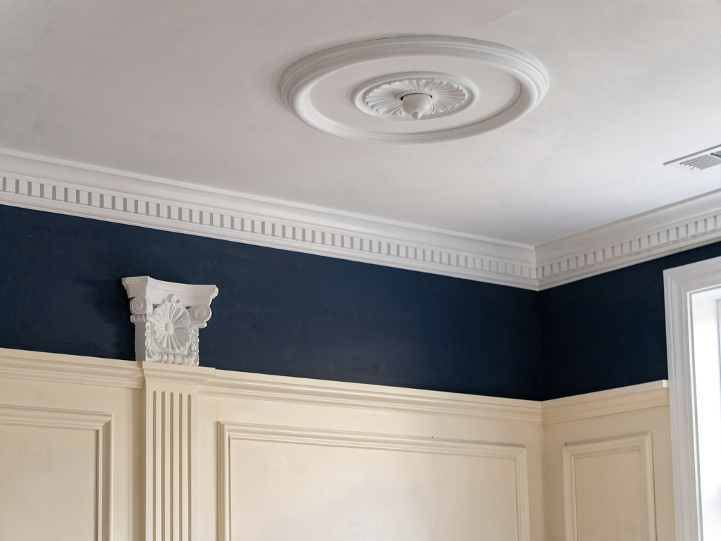 Traditional interior design architectural details showing crown molding wainscoting and trim